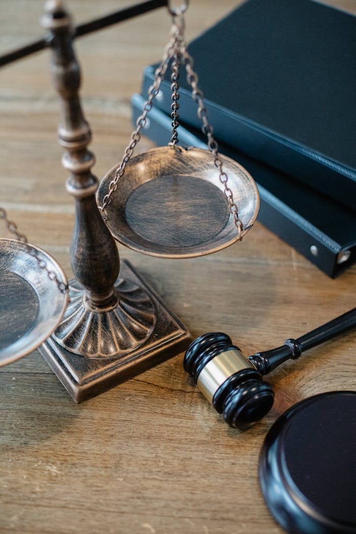 menu-13 From above of judicial symbols consisting of Scales of Justice and small judge hammer with curly handle