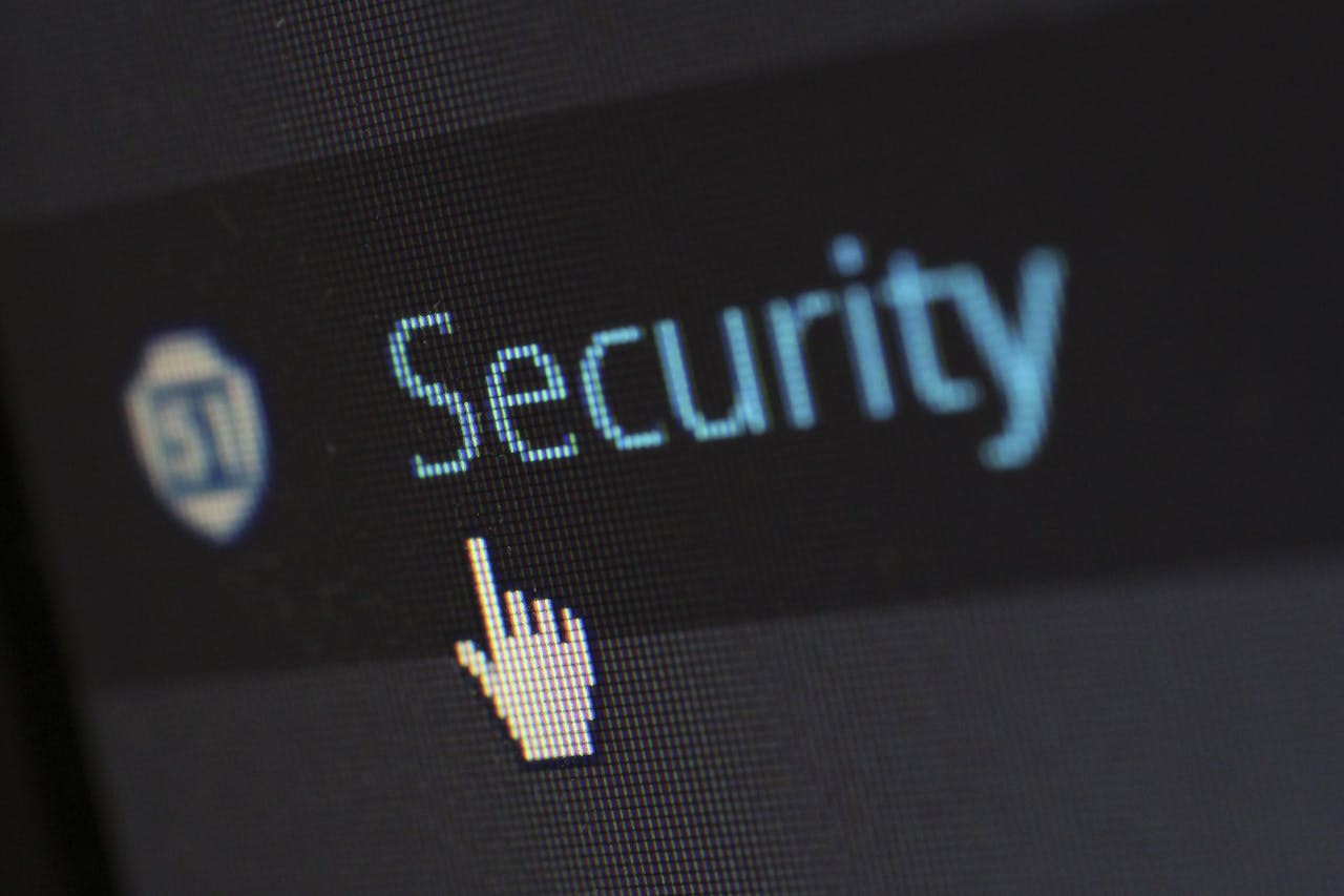 about-04 Close-up view of a mouse cursor over digital security text on display.